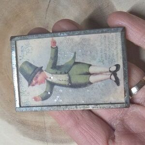 Vintage St. Patrick's Day postcard featuring a young man in a green suit pin